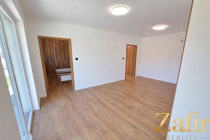 Interior of a family house with a wooden decor floor and wooden furniture.