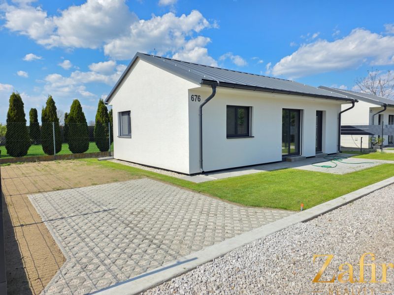 A family house in Kajal with a well-maintained garden and house number 676.