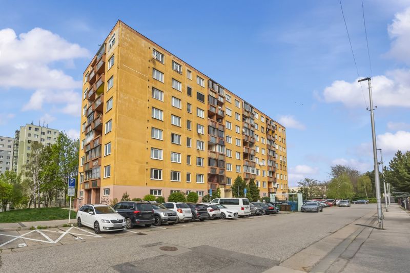 Apartment building in Bratislava - Devínska Nová Ves, Štefana Králika. Parking lot and cars.