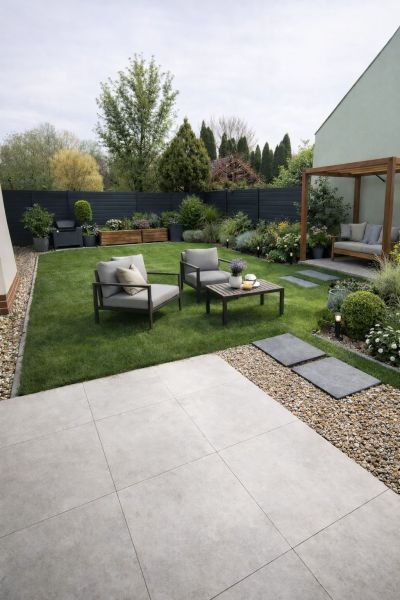 A landscaped garden of a 2-room apartment in Tomášikovo with seating and a pergola.
