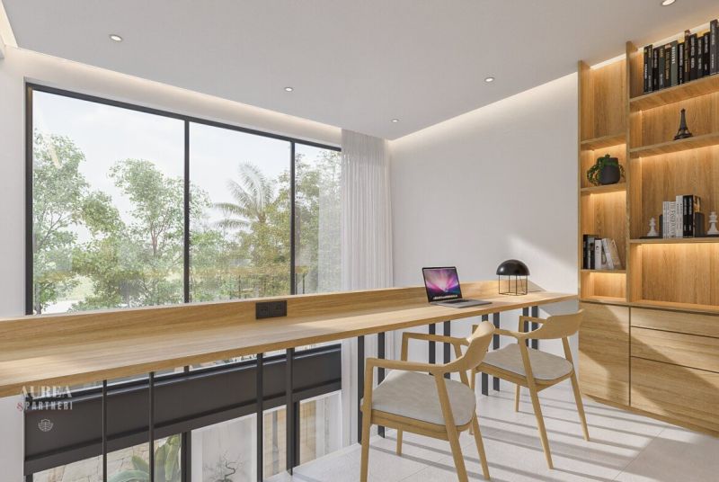 A workspace with wooden decor, large windows, and shelves with books in a villa.