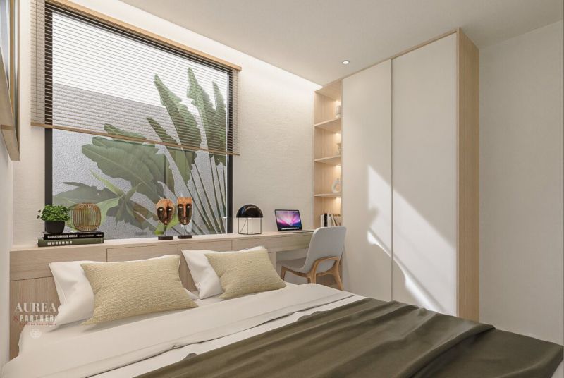 Bright bedroom with a desk, decorations, and a large window.