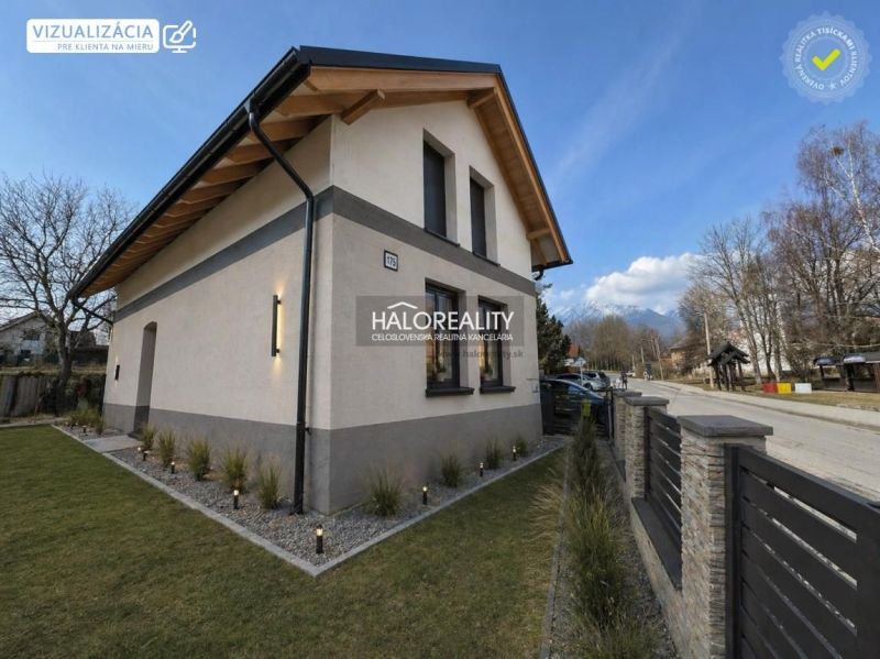 A family house in Nová Lesná with wooden cladding and a stone facade, mountain view.
