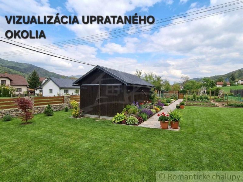 A family house in Stožok with a wooden shelter, green grass, and flowers in the garden.