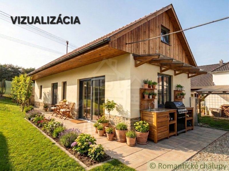 A family house in Stožok with a terrace, grill, and flowers in the garden.