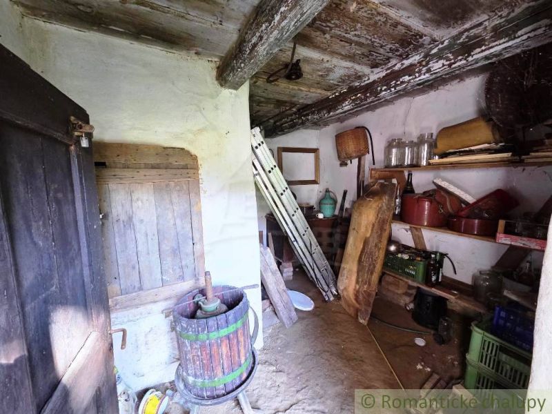 A cottage with historical objects and wooden flooring.