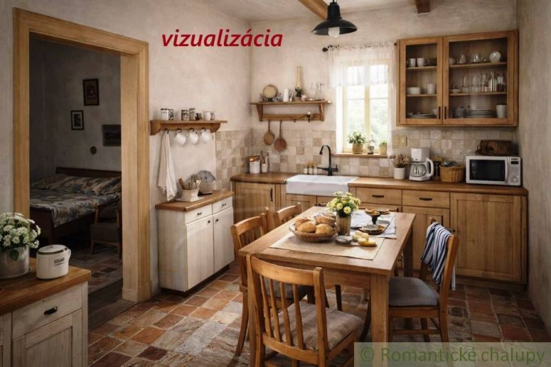 Interior of a cottage with a rustic kitchen, wooden furniture, and a dining table.