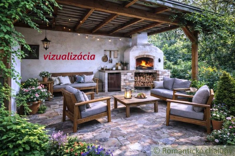 Outdoor terrace of the cottage in Šahy with a fireplace and comfortable seating.