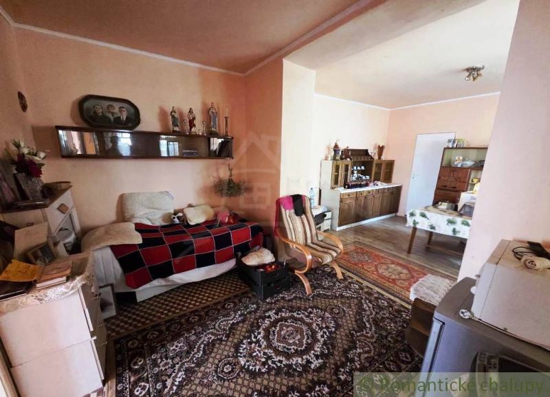 Living room in a family house with furniture and decorations in a classic style.