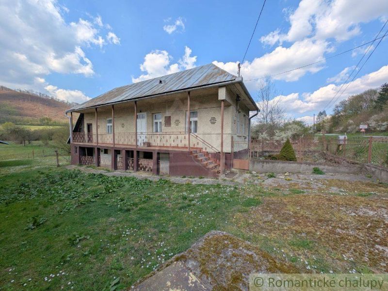 A family house in Zubné, surrounded by greenery and hilly landscape.