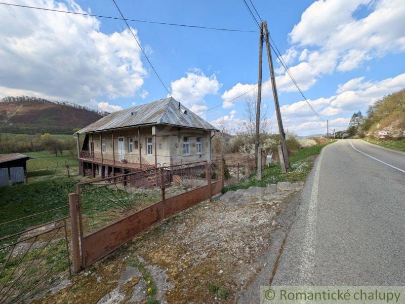 A family house in Zubné with a veranda, next to the main road and close to a hilly area.