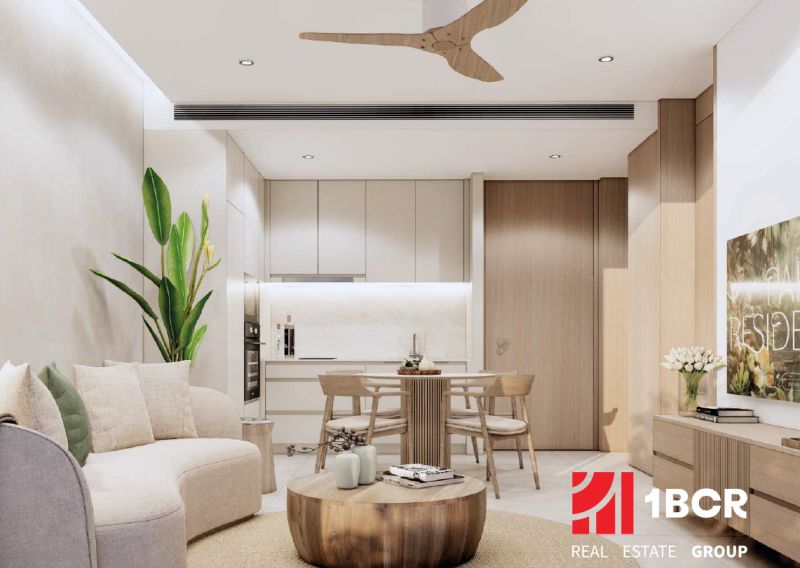 Living room in a two-room apartment with light furniture and a wooden decor floor.
