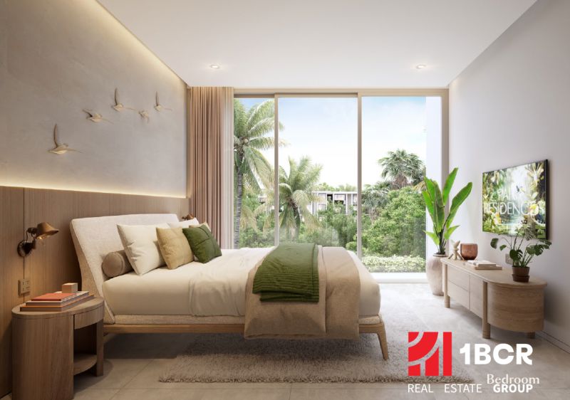 A bright bedroom with large windows, a bed, and wall decorations in a 2-room apartment.