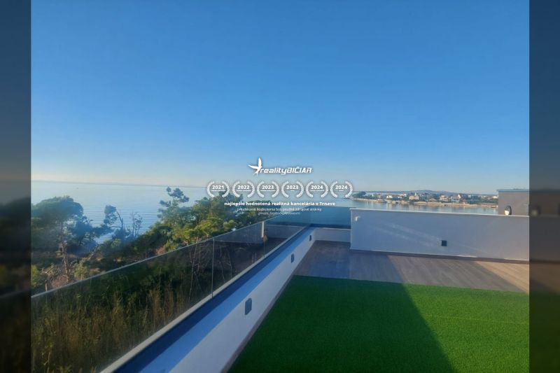 Sea view from the terrace of a holiday apartment in Privlaka, Privlaka, with a wooden decor floor.