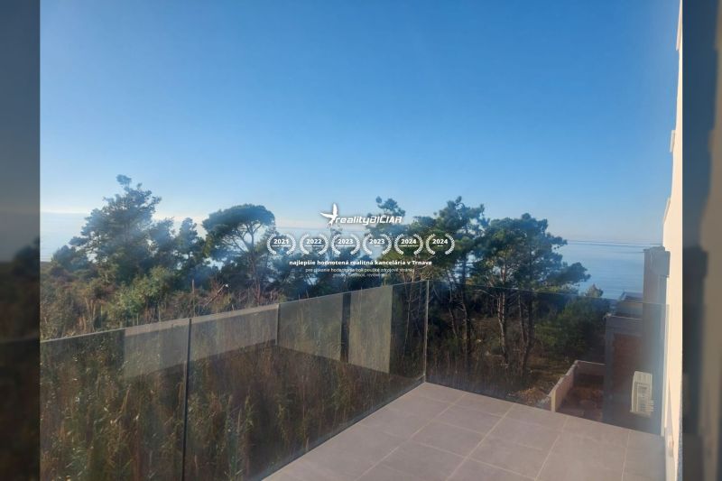 Sea view from the terrace of a Holiday Apartment in Privlaka with elegant glass.