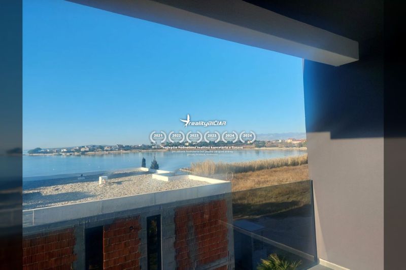 View from the holiday apartment in Privlaka to the peaceful coast of Privlaka street.