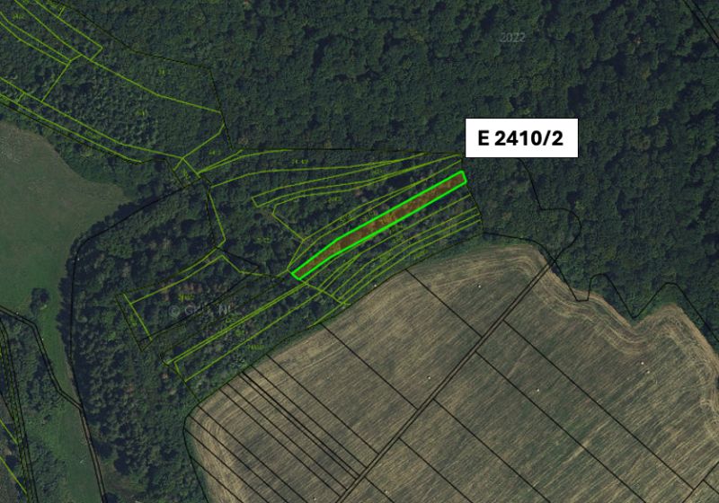 The aerial photograph shows agricultural and forest lands in the area of Veľký Šariš.
