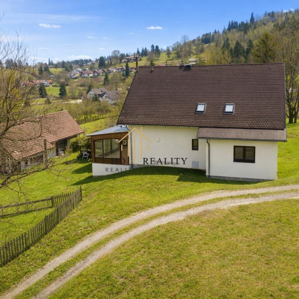 A family house in Oravská Lesná surrounded by green countryside on Oravská Lesná street.