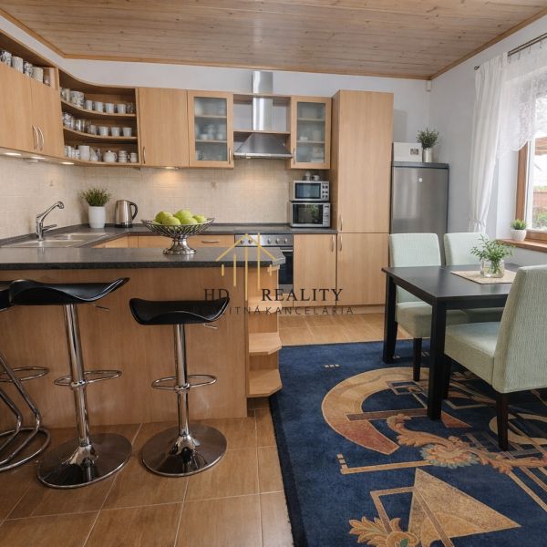 A kitchen in a family house with wooden decor and a dining nook.