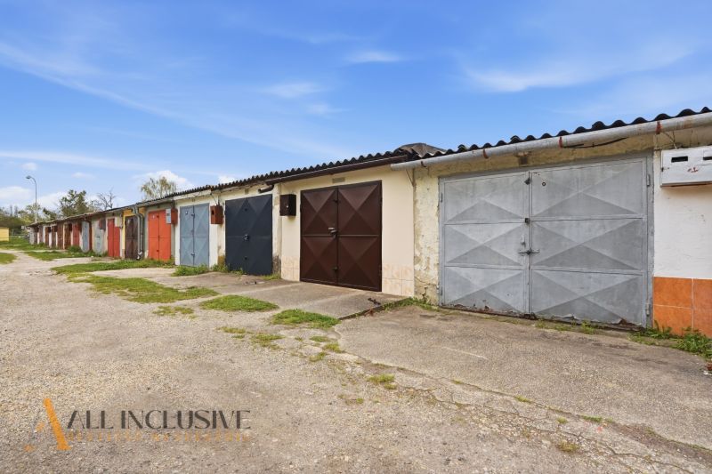 Garages on Hviezdna Street in Komárno with colorful doors and a concrete surface.