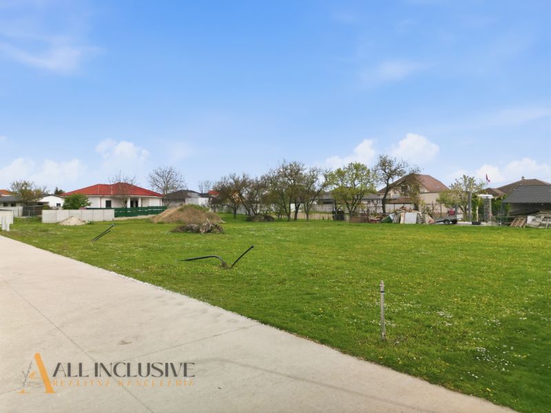 Lands - housing in Rohovce with grassy area and surrounding family houses.