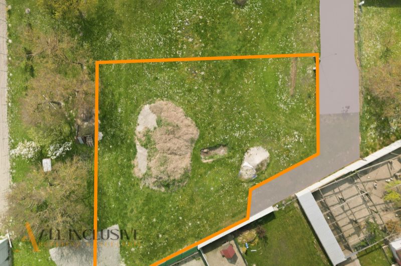 A plot for residential use in Rohovce surrounded by green grass and trees.