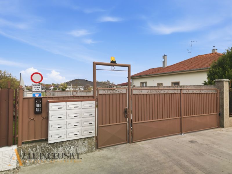 Gate and mailboxes on a residential property in Rohovce.