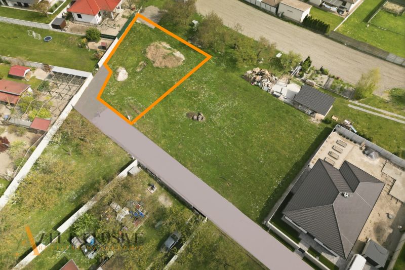 A plot for residential use in Rohovce marked in orange, surrounded by other houses and greenery.