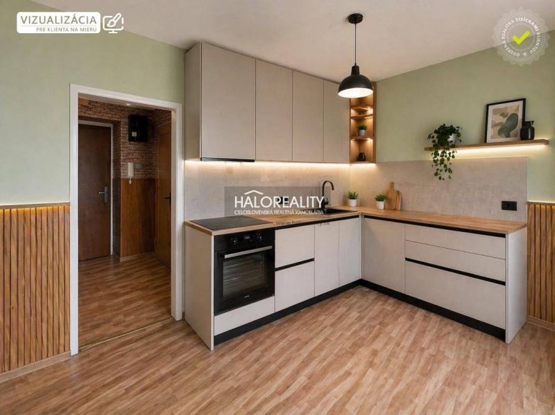 A kitchen with wood-patterned flooring and light-colored cabinets in a studio apartment.