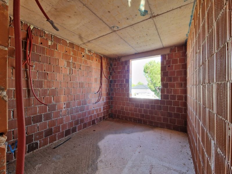 Interior construction with brick walls in a 3-room apartment.