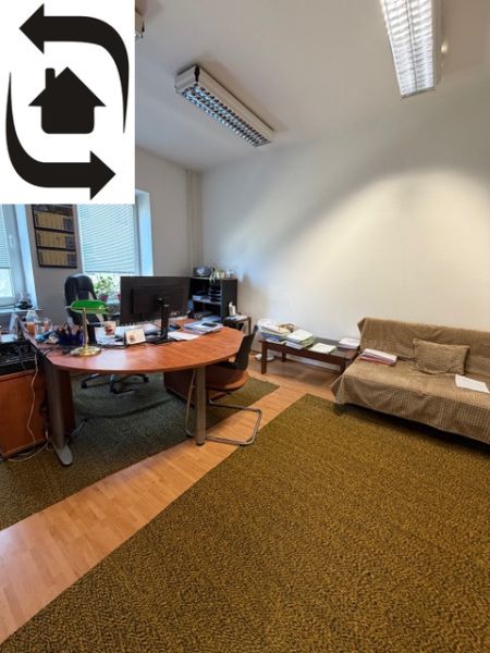 Offices with carpet and wood-patterned flooring include a desk and a sofa.