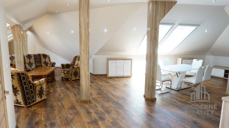 Attic space of a 4-room apartment with furniture and flooring featuring a wooden decor.