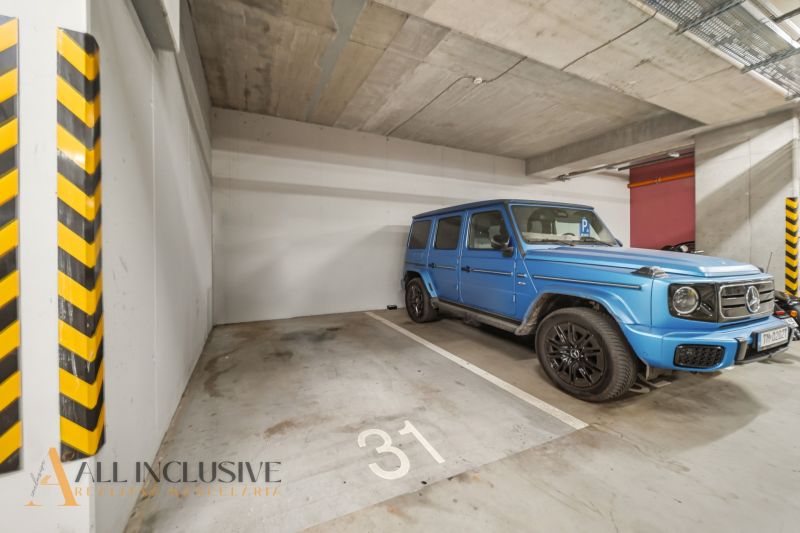 Garage parking with a blue SUV in a 2-room apartment on Zuzany Chalupovej in Bratislava - Petržalka.