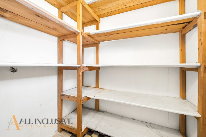 Storage space with wooden shelves in a family house.
