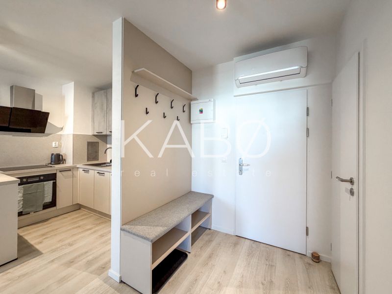 Interior of a 2-room apartment with a kitchen, hallway, and floor with a wooden decor.