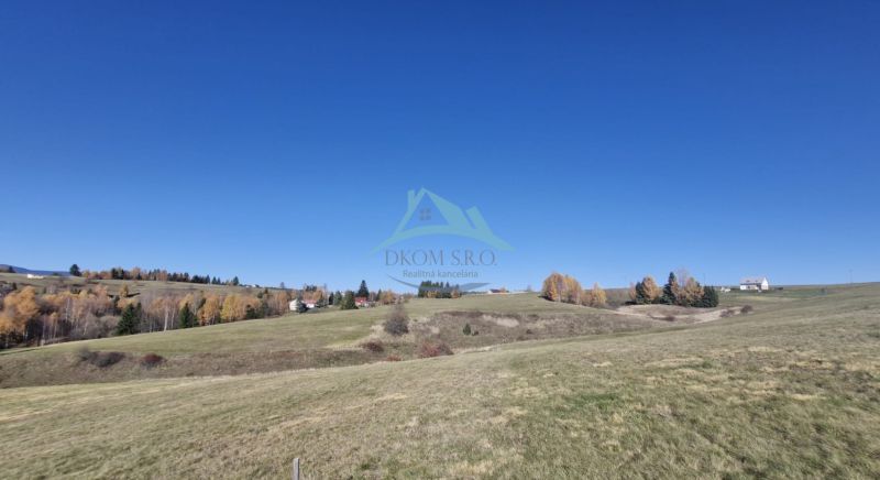 Plots - housing in Detvianska Huta, open countryside with rural buildings and trees.