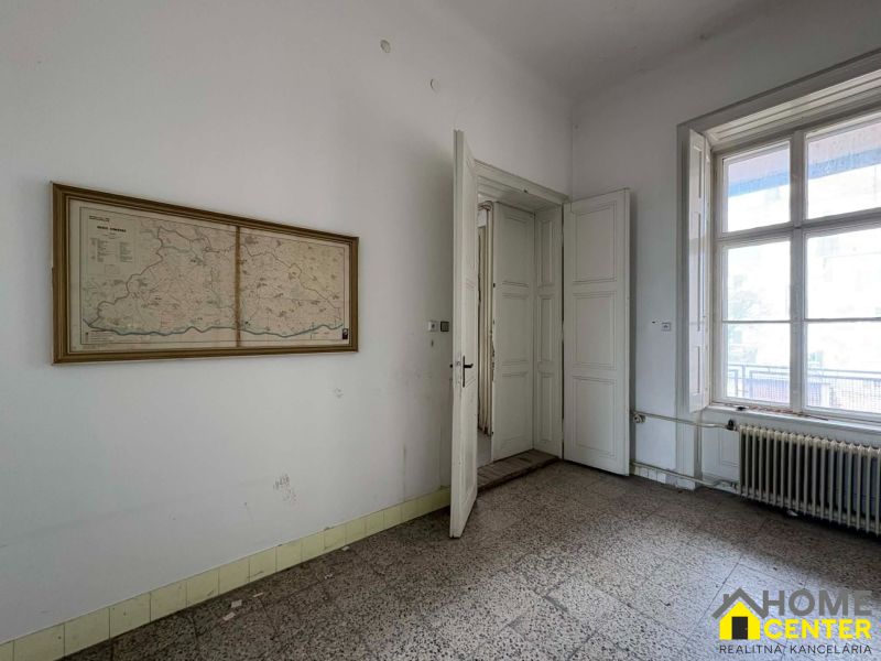Interior with an old map on the wall, the space belongs to peculiar properties.