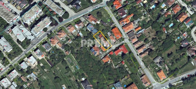 Aerial view of family houses and gardens on Krátka Street in Dunajská Lužná.