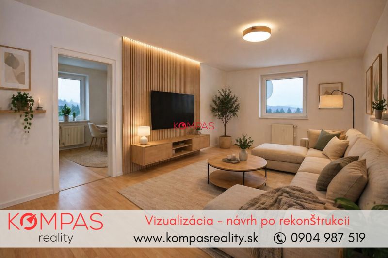 Living room in a two-room apartment with a wooden decor floor and a comfortable sofa.