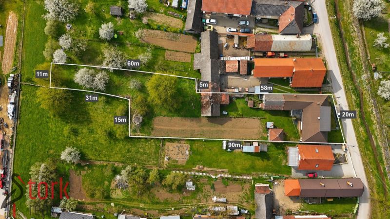 An aerial view of family houses in Horná Súča surrounded by greenery and gardens.