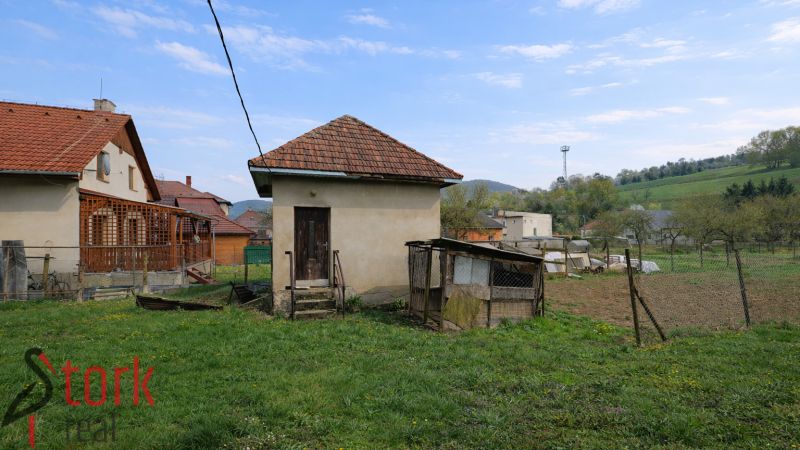 A family house in the village of Horná Súča with a small extension and a garden.