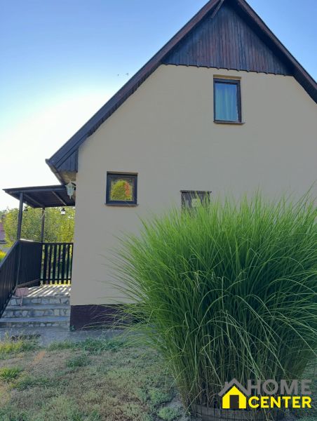 A family house with a garden in Chotín on Pri stanici street, surrounded by greenery.