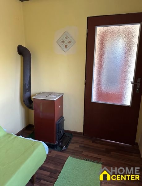 Bathroom with a stove, sofa, and wooden decor flooring in Gardens.