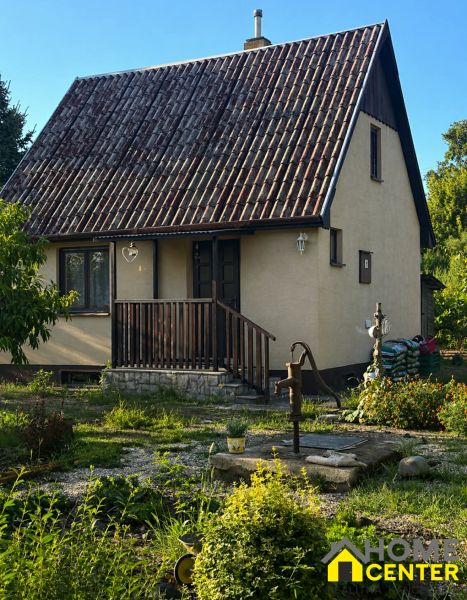 A family house with an old roof and a garden on Pri stanici Street in Chotín.