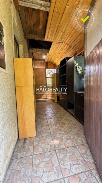 A narrow hallway with built-in wardrobes in the Gardens provides storage space.