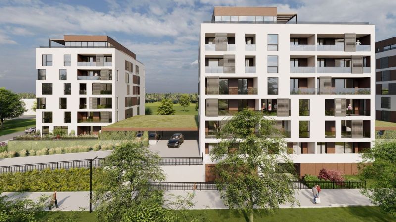 Apartment buildings on Suchoňova Street in Poprad with a green roof and parking.
