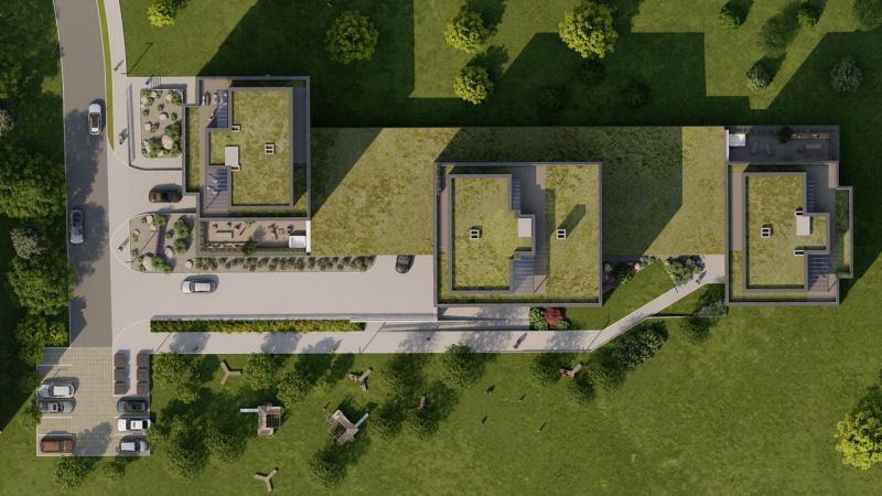 An aerial view of the roofs and surrounding park of a trio of buildings on Suchoňova Street in Poprad Juh.