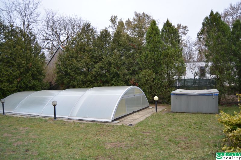 Covered pool and hot tub in the garden of a family house on Húšky, Borský Svätý Jur.