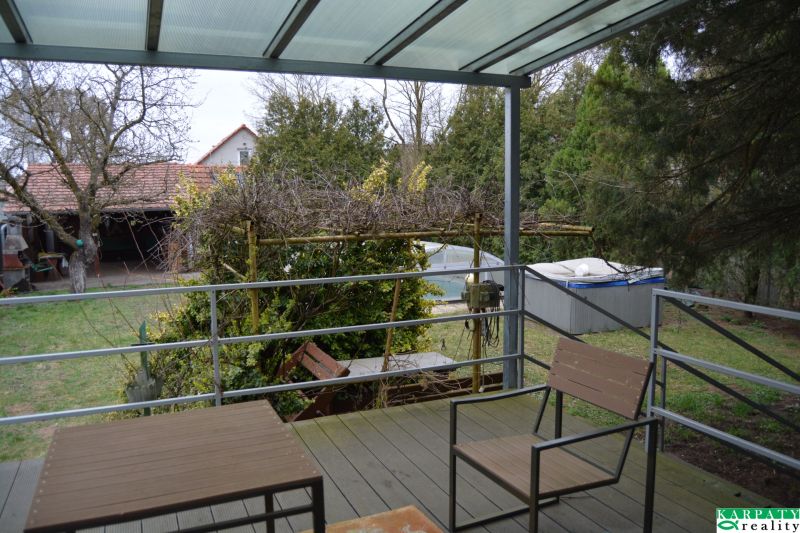 The terrace of a family house on Húšky in Borský Svätý Jur with a view of the garden.