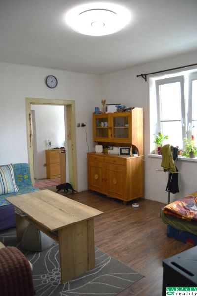 Living room of a family house with furniture and flooring with a wood decor.